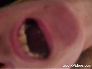 Woman spreads her mouth in a close up video