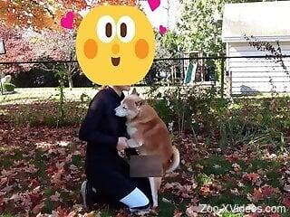 Clothed man gets intimate in the park with his own dog