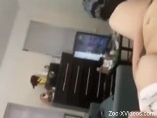 Chubby woman films herself when the dog licks her cunt